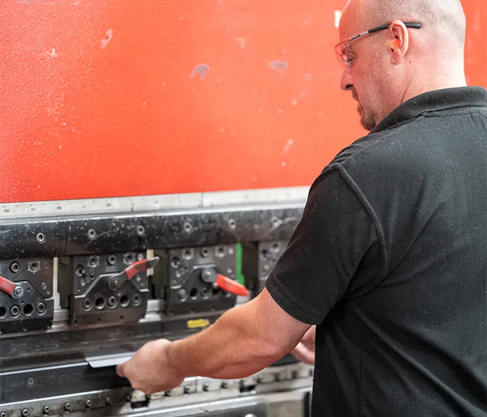 Staff using folding machine