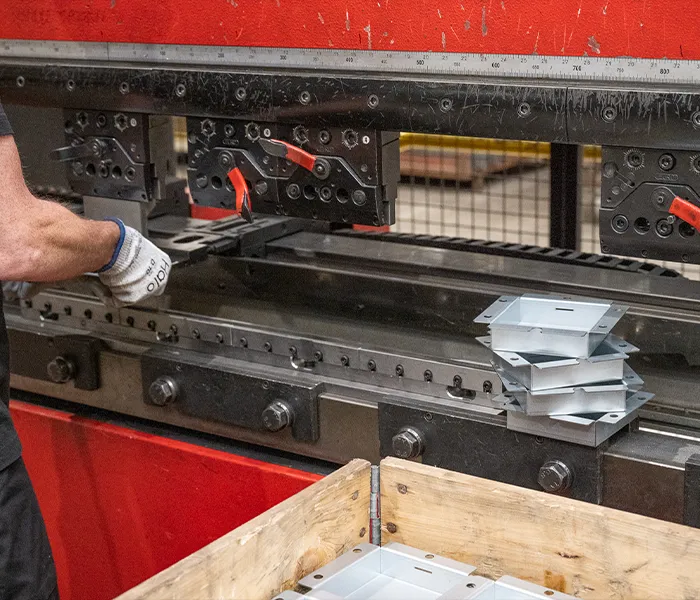 Staff using folding machine